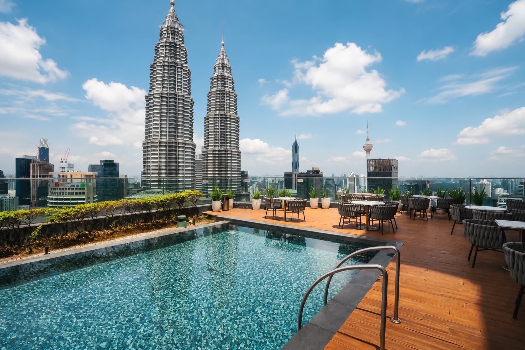 Rooftop pool with a view of the Petronas Twin Towers, Star Residences by Soulasia